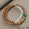 Pulseira de contas de oração budista de madeira crua natural, vendida a quente, sândalo dourado, sândalo Barbie, pulseira colecionável para homens e mulheres, fornecimento para live-stream
