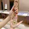 Chaveiro Dourado Ouro Puro 999 Corrente para Celular Bolsa Pingente com Dinheiro para Gastar Ano Novo Presentes Pequenos Culturais e Criativos Atacado