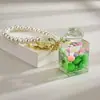 Garrafa de areia movediça de celebridade da internet criativa com contas coloridas em um pingente de garrafa de óleo acrílico chaveiro pingente bolsa pequenos acessórios atacado
