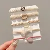 Nuevas diademas de alta gama 2026 para mujer, ligas de goma, cordones para el pelo, anillos para el pelo, cubiertas de cuero, accesorios para el pelo de niña con un toque de sofisticación