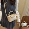 Venta al por mayor Estilo Coreano Simple Bolso Cuadrado Pequeño de Mano Bolso de Mujer 2025 Verano Nuevo Estilo Estilo Lujo Ligero Bolso de Hombro Bolso Cruzado para Viaje
