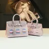 Bolso Platino 2026 Nuevo Modelo Bolso de Mano de Cuero Genuino para Mujer Bolso de Hombro Simple Versátil Bolso Cruzado para Viajar con Bloques de Color