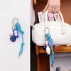 2025 Tendencia Verano Serie Miu Nueva Moda Estilo Ins Colgante Bolso Coche Pareja Llavero Versátil Mayoreo