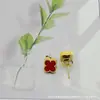 Pendientes de Trébol de Cuatro Hojas Mini de 9 mm de Venta Caliente Transfronteriza, Joyería Sencilla para Mujer, Pendientes de Acero de Titanio Color Oro 18K Conservante de Color por Vacío