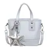 Bolso de mano de nicho para mujer 2026 nuevo de moda primavera alto valor para el trabajo bandolera tipo cubo bolso de hombro casual