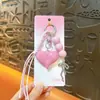 Colgante para llavero de bolso con forma de lazo de corazón estilo Miu creativo, colgante lindo para mochila, accesorios pequeños para manualidades, venta al por mayor