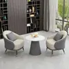 Set sencillo y elegante de sofá individual y mesa de centro, adecuado para áreas de descanso, recepciones de hotel, oficinas de ventas y salas de reuniones
