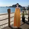 Vestido de tirantes con borlas amarillas para mujer, verano, alta gama, súper favorecedor, vacaciones junto al mar, elegante falda larga