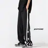 Pantalones de rayas para hombre primavera y otoño retro japonés moda de alta calle americana marca draping pierna ancha rectos hasta el suelo casual deportivos