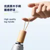 Paraguas manual plegable de madera al por mayor con 70% de descuento, paraguas de titanio con pegamento plateado para mujer, protección solar de alta gama, protección UV, paraguas para todo tipo de clima