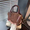 Bolsa de mão de alta qualidade com estampa de leopardo para mulheres, novo estilo coreano moderno de 2026, bolsa de ombro versátil e elegante, bolsa transversal, bolsa tipo balde