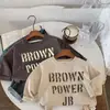 Camiseta de Manga Larga de Otoño para Niños 2026 Nueva Versión Coreana Top Casual con Estampado de Letras para Niños y Niñas Cuello Redondo Camisa Base Holgada