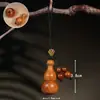 Colgante de Calabaza Pequeña Fu Shou de Madera Espiral Abrible Adorno Colgante Cuerda Tejida Tallado a Mano Adorno de Cultura Tradicional