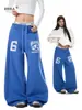 Pantalones de chándal casuales retro azules estilo callejero para mujeres y hombres, nuevo modelo de primavera, pantalones simples estampados curvos, pantalones de pierna ancha relajados y versátiles