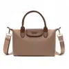 Bolsa tipo dumpling de color block de comercio exterior para mujer, nuevo modelo 2026, bolso de hombro casual versátil, bolso de mano texturizado para ir al trabajo y uso cruzado