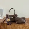 Bolso modelo nuevo 2026 transfronterizo, bolso de mano simple estilo coreano, bolso tipo cubo de moda de gran capacidad, bolso cruzado casual para el día a día