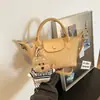 Bolsa de mão tecida de alta qualidade transfronteiriça para mulheres, nova super popular outono 2026, bolsa de ombro e transversal para o dia a dia