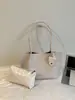 Bolsa de mano tejida de gran capacidad transfronteriza, moderna, casual, versátil, adecuada para ir al trabajo, bolso de hombro de moda de nicho, bolso de axila elegante