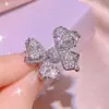 Tiktok live venta caliente collar de cadena de hueso de arco marino pendientes de botón brillantes de diamantes completos anillo traje de joyería venta al por mayor