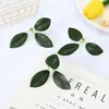 Hierba paisajística de hojas verdes artificiales verde azulado accesorios de plantas verdes falsas de plástico accesorios de maceta decoración accesorios al por mayor