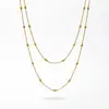 Estilo europeo temperamento diseño sentido cadena de hueso de serpiente sensación lujo ligero colgante verde esmeralda titanio acero collar mujeres conjunto apilable