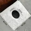 Toallas faciales desechables, gruesas y transpirables para usar en camillas de masaje en salones de belleza, incluyendo toallas faciales con agujeros en forma de cruz.