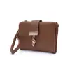 2026 Cartera Nuevo Estilo Estilo Coreano Piel Sintética Cartera Corta Color Sólido Hebilla Plegable Cremallera Bolso de Mano para Estudiantes Damas Cartera