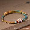 Suministro en vivo Qianli Jiangshan combinación de colores cuerda para la mano semiacabado usable cuentas de agujero grande tejido a mano tendencia nacional estilo nacional pulsera