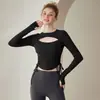 Top de yoga de alta gama, hueco, con cordón para otoño e invierno, con sujetador incorporado, mangas largas, un ajuste sexy y adelgazante, y diseñado para entrenamiento de Pilates