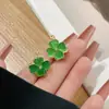 Aretes de Flor de Trébol de Cuatro Hojas Fresca Estilo Mori de Alta Calidad Dulces de Doble Cara Piedra Ojo de Gato Pendientes Versátiles