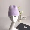 2022 nuevo gorro de punto con volantes de color liso para mujer, gorro de invierno de otoño e invierno, gorro de lana cálido de comercio exterior, combina con todo