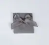Bolsa de solapa flocado para joyería de doble cara con decoración de corbatín, bolsa de embalaje universal, bolsa de regalo aterciopelada a prueba de polvo