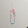 Nova cor laço amor corrente de telefone cordão de telefone com contas pingente para capa de celular pulseira de pulso resistente a quedas para mulheres