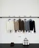 Han Xun Camisa de Lectura a la Moda Cuello de Camisa Aspecto de Dos Piezas Superpuesto Suéter de Punto Trenzado para Mujer Otoño/Invierno 2026 27558