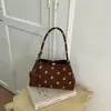 Bolso de axila retro de lunares estilo francés para mujer, nuevo bolso de hombro único para el verano 2026, simple y elegante para ir al trabajo, diseño de nicho