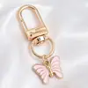 Colgantes de dibujos animados rosas lindos estilo coreano, dijes de aleación de esmalte de conejo y estrella, llaveros con anilla en D, accesorios para manualidades, venta al por mayor