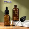 Botella de aceite esencial marrón separada de 60 ml con tapa de rosca antirrobo y gotero de goma para dispensar suero y cuidado de la piel botella de vidrio
