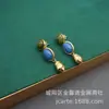 Joyería de comercio exterior de Qingdao joyería de lapislázuli collar vintage conjunto de pendientes estilo europeo y americano collar liso de oro diseño de nicho