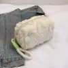 Neceser en stock, bolso de peluche, nuevo bolso de maquillaje transfronterizo, bolso peludo, bolso para teléfono con forma de corazón, bolso de mano portátil
