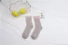 Calcetines japoneses de forro polar de coral para mujer de invierno, calcetines de medio terciopelo, calcetines para dormir, calcetines de forro polar de coral, ventas directas de fábrica de origen