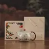 Tetera estilo chino de gres Ru, tetera pequeña cultural y creativa de Dunhuang, regalo corporativo de negocios, tetera para uso doméstico con filtro