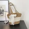 Bolso de Paja Tejida para Mujer Estilo Francés con Adorno de Encaje 2026 Nuevo Verano para Salir a la Playa Estilo Ins Bolso de Hombro Único Tipo Cubo