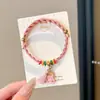 Pulseira de corda colorida zongzi do Festival do Barco-Dragão 2026 novo modelo pulseira trançada artesanal étnica infantil atacado corda vermelha