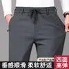 Calça casual masculina com cintura totalmente elástica em nylon-spandex, novo modelo outono/inverno 2026, perna reta, cintura média-alta, calça casual de cor sólida para homens