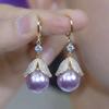 Pendientes de lujo ligeros de alta gama con cuentas rojas y hojas, diseño de nicho, hebilla para la oreja, elegantes y a la moda, que combinan con todo.