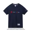 Camiseta de Manga Corta de Algodón Puro Unisex 2026 Nueva Camiseta Bordada Holgada Ins Marca de Moda Estilo Japonés Hong Kong Top Verano