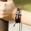 Pulsera unisex al por mayor de joyería de Yiwu estilo europeo y americano pulsera de cruz de cuero genuino pulsera de piel de vaca