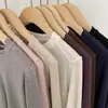 Camiseta Básica de Lã Tencel com Gola Redonda para Mulheres Cor Lisa Dividida no Ombro em Ângulo Reto Manga Longa Solta Camiseta Interna Macia e Cerosa para Mulheres