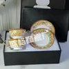 Suministro directo transfronterizo Juego de taza de café H de moda Juego de té de la tarde europeo taza de té negro café 2 tazas 2 platos caja de regalo