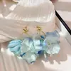 Pendientes de borla de flores con atmósfera súper de hadas, pendientes de temperamento fresco pequeño Mori, pendientes de nicho de alta gama al por mayor para mujer